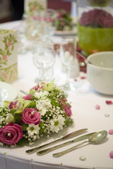 elegant dinner table with flowers and glass