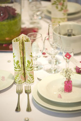 elegant dinner table with flowers and glass