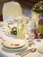 elegant dinner table with flowers and glass