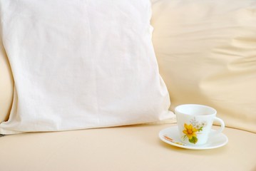 Closeup of cup on sofa