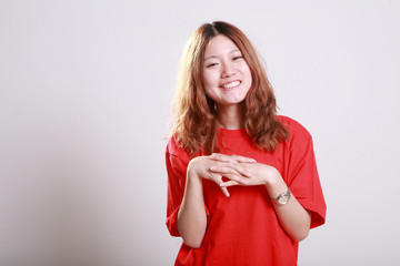 female model posing in bright red t-shirt