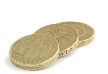 British one pound coins on a white background