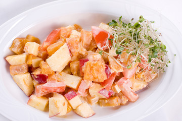 salad of pumpkin, apples and tomatoes