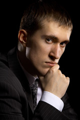 man in suit on black