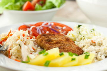 Schnitzel with potatoes and salads