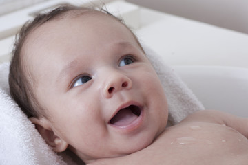 Beautiful baby boy bathing