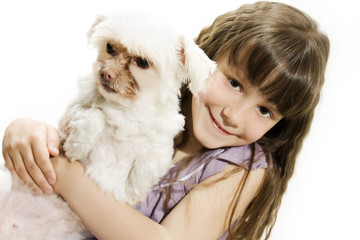 Little girl sits with her dog