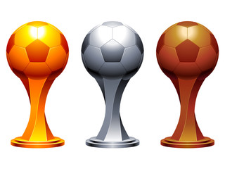 Golden, silver and bronze soccer trophy cups. © Timurock