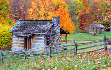 Log cabins during autumn in the mountains.