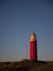 the lighthouse of texel in the evening light