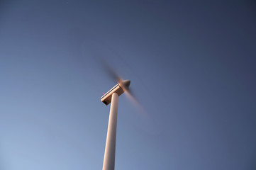 Eolic power generator: windmills over blue sky