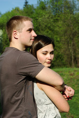 Young couple embracing in the sunset