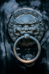 antique oriental door knocker .