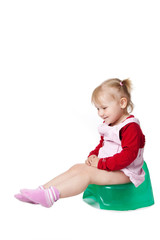 little girl sitting on potty