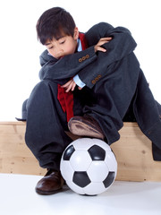 boy in business suit wondering about his future