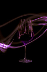Abstract light around red wine glass
