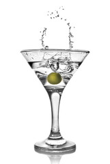 martini with olive and splash isolated on white