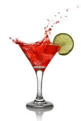 Red cocktail with splash and lime isolated on white
