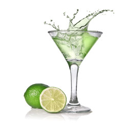 Green alcohol cocktail with splash and green lime