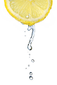 fresh water drop on lemon isolated on white