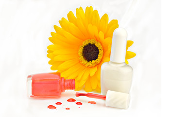 Red and white nailpolish and arificial yellow silk flower