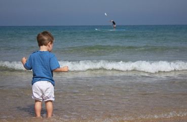 2-year-old child playing on the beach