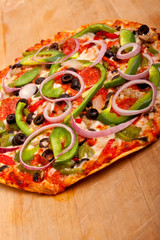 Pizza with vegetables and pepperoni