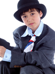 boy in business suit with red, white & blue tie