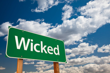 Wicked Green Road Sign with Sky