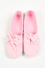 a pair of pink women shoes and white background