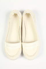 a pair of white women shoes and white background