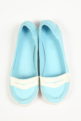 a pair of blue women shoes and white background