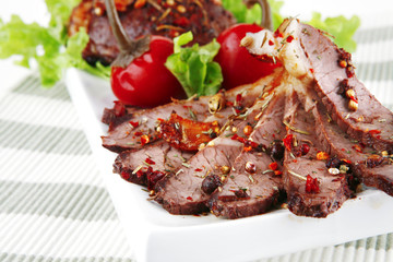 beef meat slices on ceramic plate