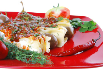 cheese cannelloni on red plate