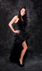 Fototapeta na wymiar Glamorous woman with black dress and beautiful hair