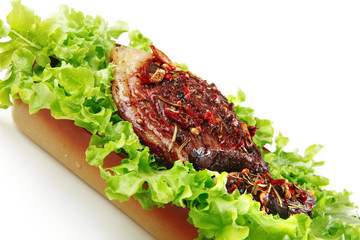 served beef meat on salad