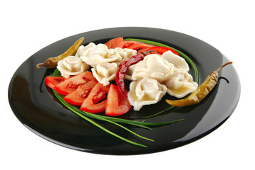 dumplings with peppers on black