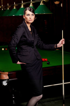 Glamorous lady with cue