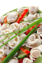 dumplings with peppers on green