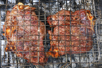 cooked beef steak on charcoal