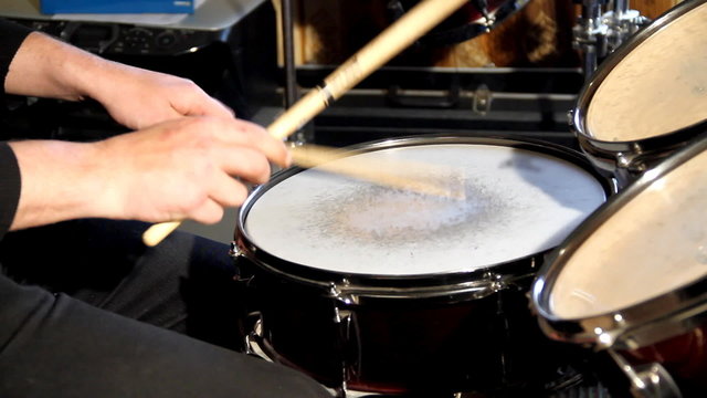 Playing drummer