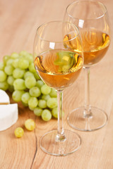 Still-life with bunch of grapes and white wine