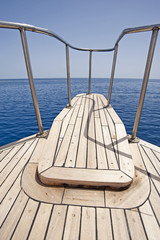 View of the ocean from the bow of a sailing yacht
