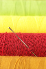 Colorful reels and needle