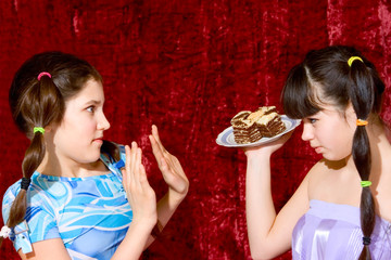 Two teen girls with cake