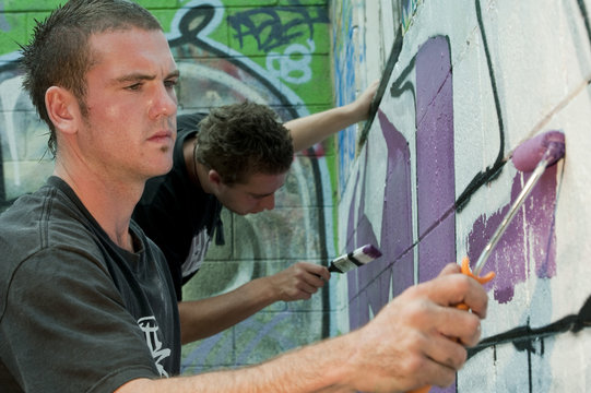 Teenage Boys Tagging Painting Graffiti