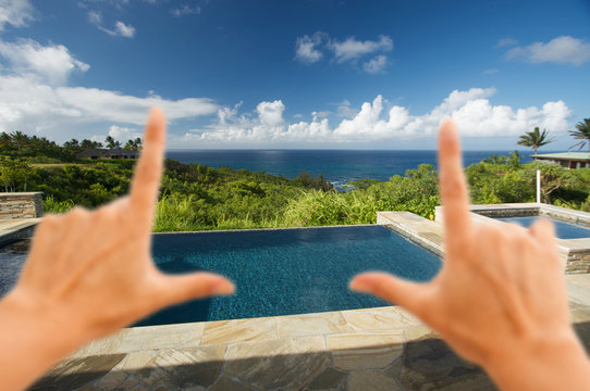 Hands Framing Oceanview Pool and Patio