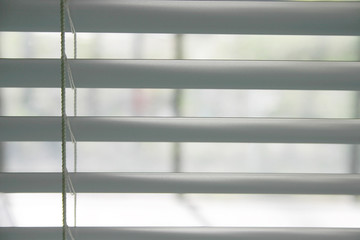 A photo of blinds  as a background.