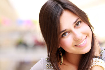 Portrait of young happy smiling woman, isolated on white