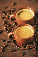 Cups of coffee and coffee beans